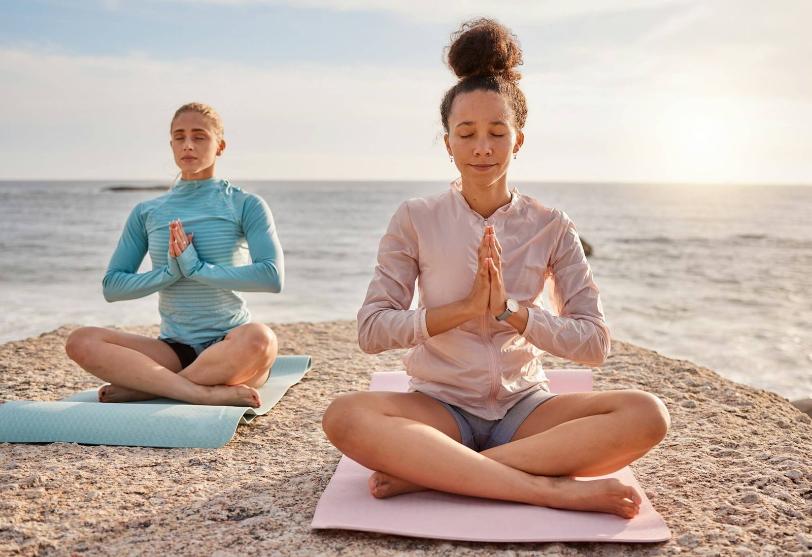 yoga-meditation-and-friends-outdoor-on-a-beach-together-for-mental-health-or-wellness-in-summer-e.jpg